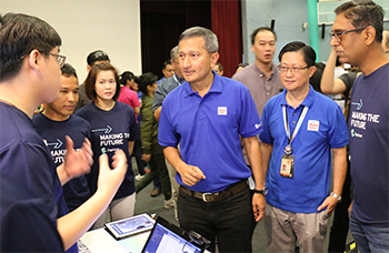 Dr. Vivian Balakrishnan (center), Singapore’s Minister for Foreign Affairs and Minister-in-charge of Smart Nation Program Office, at the Cognizant stall at Maker Faire Singapore 2017